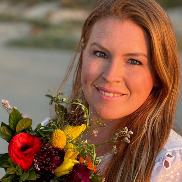 Philippa Botha with a handful of colorful blooms