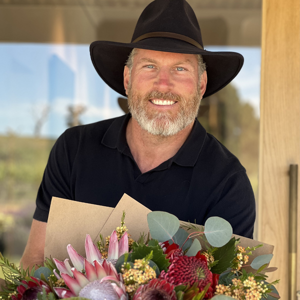 Wade Kingsley with an armload of colorful blooms