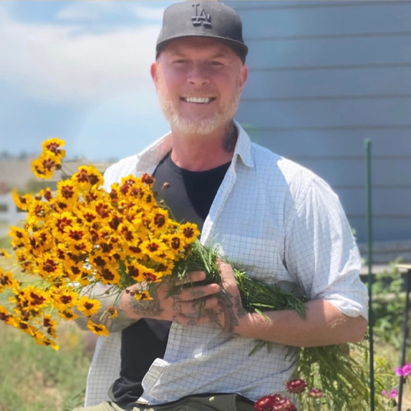 Andrew Martin with a bouquet of flowers