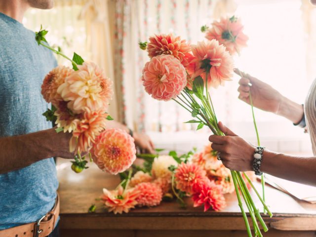 Erin and Chris Benzakein arranging dahlias in the studio